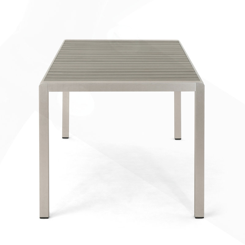 Table de salle à manger d'extérieur moderne en aluminium avec plateau en faux bois pour une utilisation élégante et durable du patio
