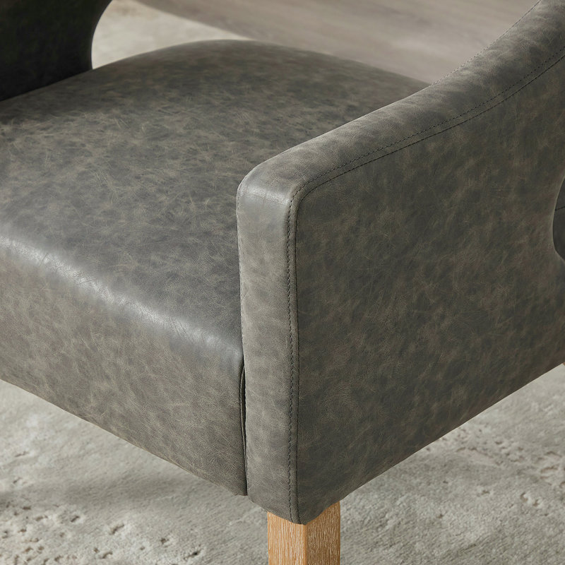 Ensemble de 4 chaises de salle à manger modernes rembourrées en polyuréthane à dossier ouvert avec des pieds en bois d'hévéa massif et des sièges en mousse à haute densité pour une utilisation dans plusieurs pièces.