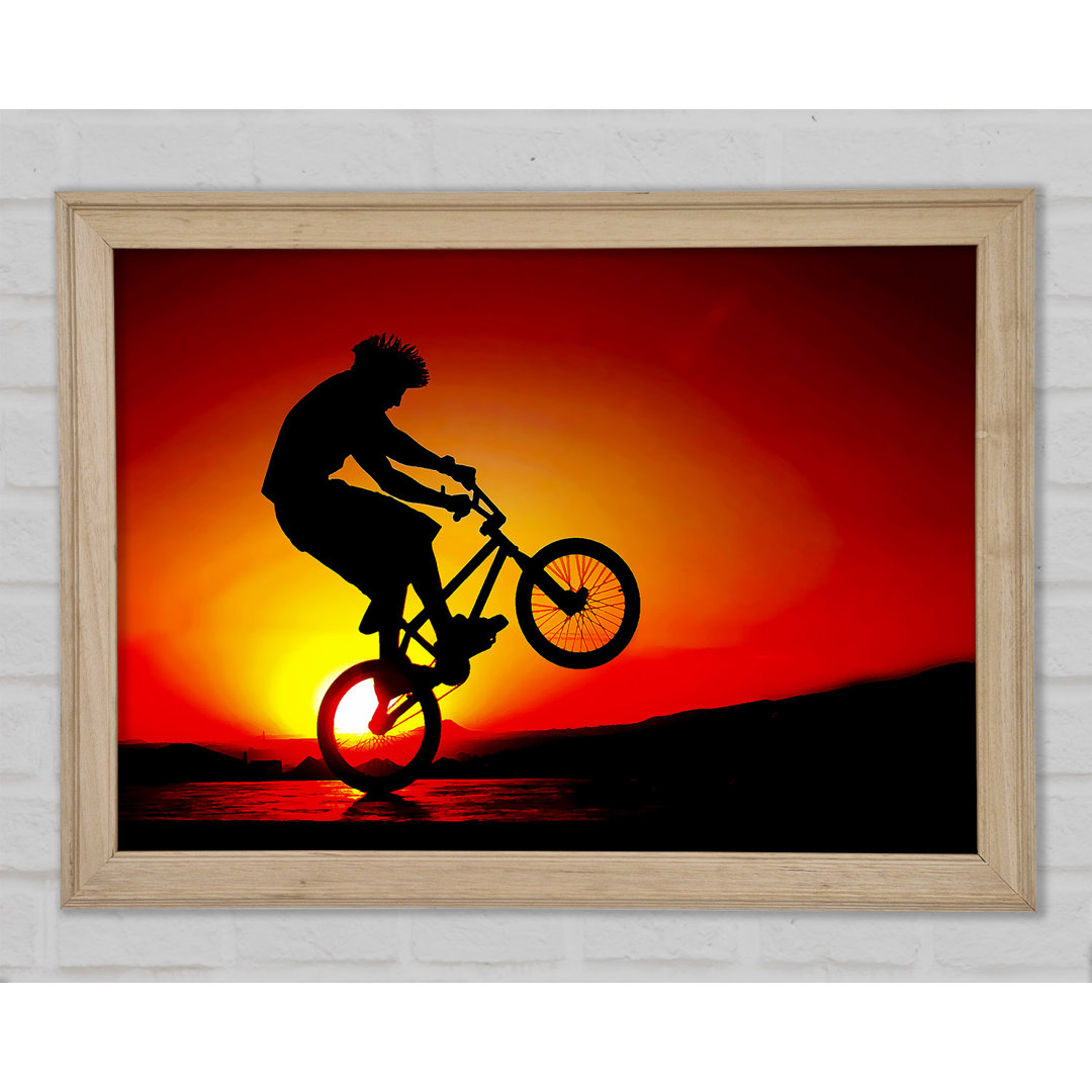 Gerahmtes Poster BMX Back Wheelie In Red Sunlight