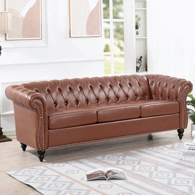 PU Rolled Arm Chesterfield Three Seater Sofa.