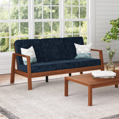3. Style Mid-century avec velours bleu marine et dossier en bois massif. Structure moderne.