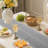Cotton Blend Hemstitched Embroidered Striped Table Runner With Tassels-113878478-113878477