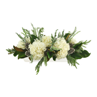Snowy Holiday Arrangement with Hydrangeas, Magnolia Leaves and Pinecones