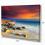 Plage avec des pierres sur le premier plan - reproduction de photo sur toile tendue-18267988
