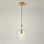 Suspension simple à une lumière, abat-jour en verre transparent, cordon réglable, idéal pour îlot de cuisine ou salle à manger.