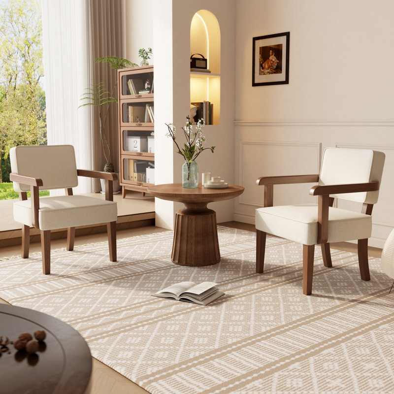 Ensemble de 2 fauteuils en bois massif rembourrés de suède beige