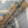 Aracelie  Geometric Patchwork Floral Area Rug in Camel