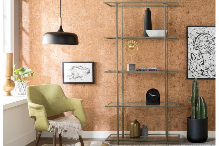 grey steel bookcase against brown wall