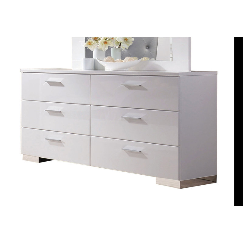 Commode blanche sophistiquée pour les chambres modernes, rehaussant le rangement et le style.