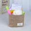 Petit panier de rangement suspendu en coton et en lin pour le bureau, idéal pour organiser des clés et des articles divers.