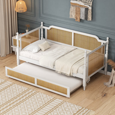 Lit de jour rétro en rotin courbé avec lit gigogne escamotable, design français