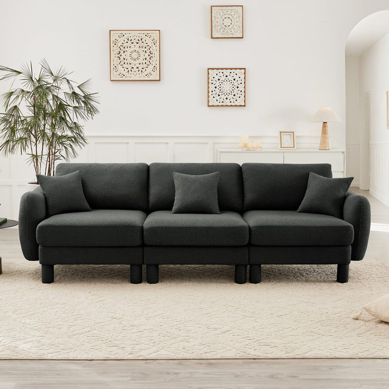 Canapé à 3 places en tissu Boucle avec accoudoirs distinctifs en forme de coquillage, pieds cylindriques enveloppés de tissu d'ameublement