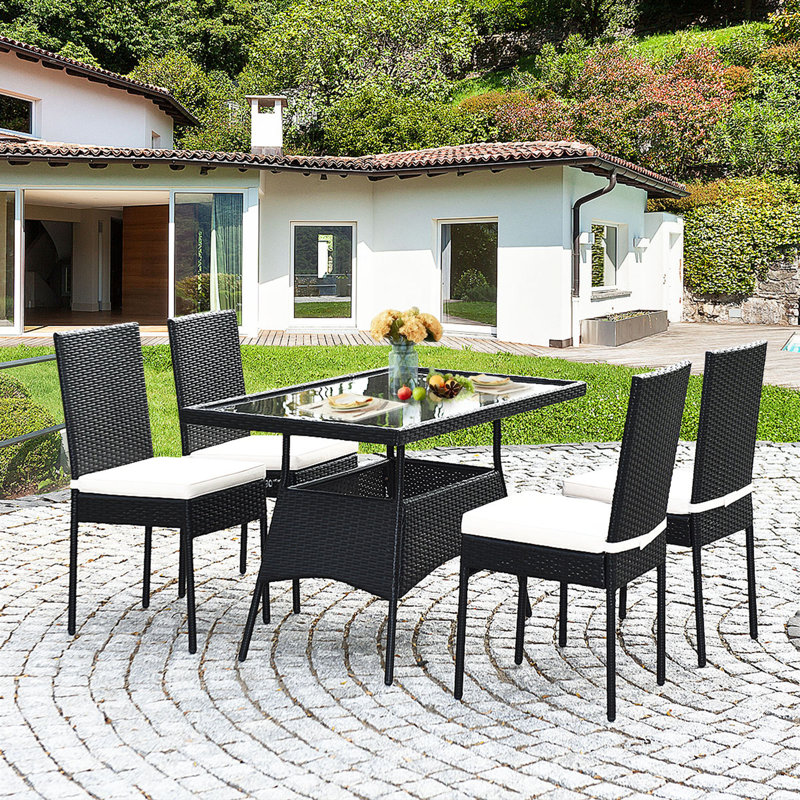 Ladera 4 - Person Wicker Patio Dining Set with Rectangular Table , Cushions Included, Black