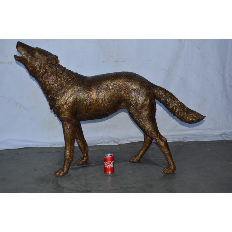 Navarrete Wolf Standing and Howling Life Size Bronze Statue - Size: 45"L x 15"W x 34"H.