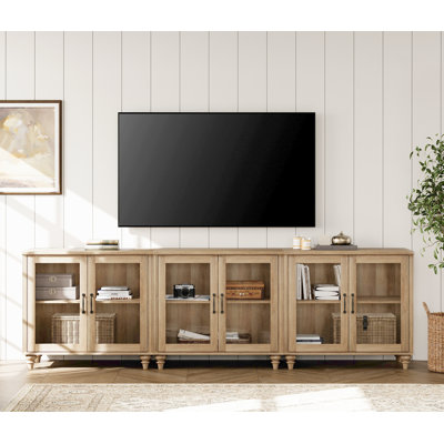 Aloysius 101.6" W Wood TV Stand with Glass Doors
