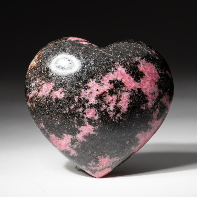 Cœur impérial poli en rhodonite de Madagascar (400 grammes), Noir / Rose, H 3 po x l 1,25 po x P 3,5 po