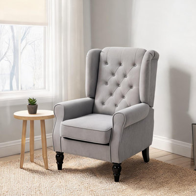 Fauteuil d'appoint en tissu capitonné à motif losanges, pieds en bois massif fini brillant, livré entièrement assemblé pour le salon.