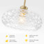 Suspension moderne en laiton naturel à une lumière avec abat-jour en verre transparent texturé diamant, tige réglable, idéale pour un îlot de cuisine ou un hall d'entrée.