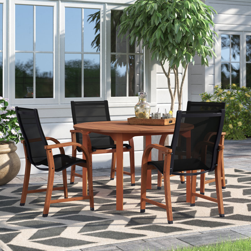 Anautica 4 - Person Wood Patio Dining Set with Round Table