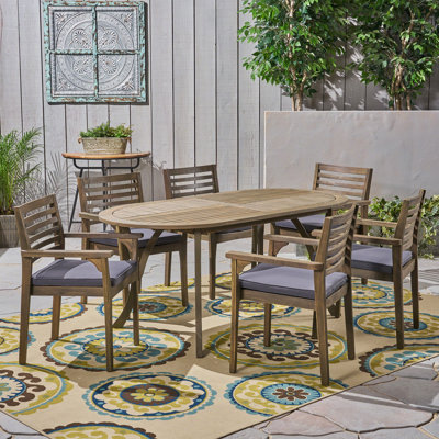 Tinnin 6-Person Acacia Wood Oval Outdoor Dining Set with Cushions 