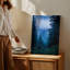 Toile «A Dense Misty Forest Scene Captured At Twilight» mettant en vedette un art mural imposant, arbres à feuilles persistantes avec différentes nuances de vert profond-1240041219