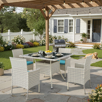 5-Piece Outdoor Rattan Dining Set With Cushions, Armchairs, And A Tempered-Glass Top Table