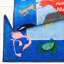 Tapis bleu à motif graphique-26307051