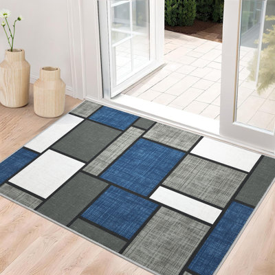 Tapis bleu foncé lavable à motif géométrique moderne