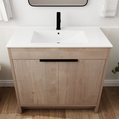 Armoire à pharmacie sur pied 36 po. Évier en céramique blanche et 2 portes d'armoire à fermeture en douceur. Éblouissement chêne clair. Tablette réglable. Poignées en métal. Meuble-lavabo à contreplaqué stable