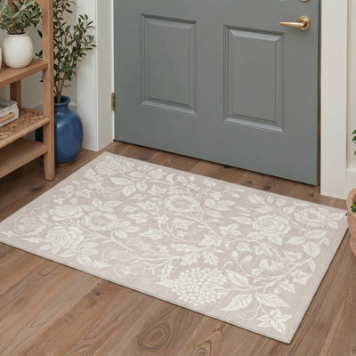 Tapis beige à motif floral Aubepine Artisan