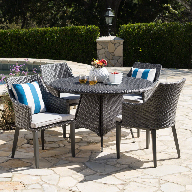 Backlund 4 - Person Wicker Patio Dining Set with Round Table , Cushions Included, Grey