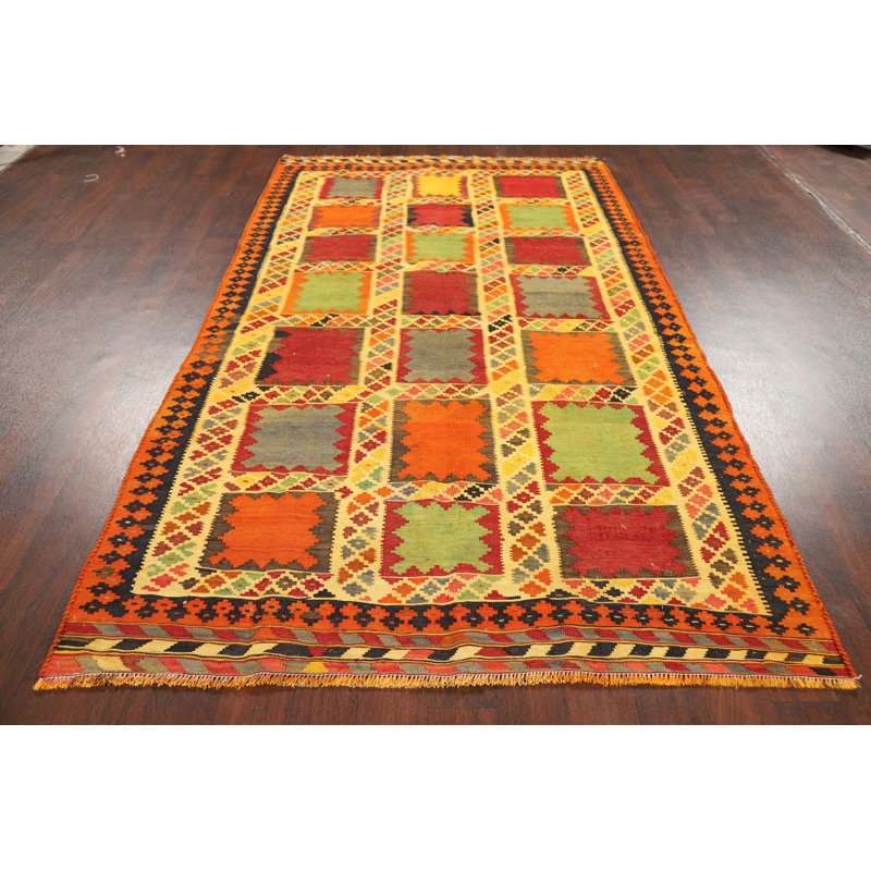 Tapis orange / jaune à motif géométrique en laine Aakiyah