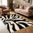 Black and Cream Abstract Monstera Leaf carpet-easy to clean, machine-washable, soft and comfortable; suitable for door mats, kitchens, living rooms, bedrooms, corridors, and laundry areas. Easy to clean, durable carpet for home decoration.-815299097
