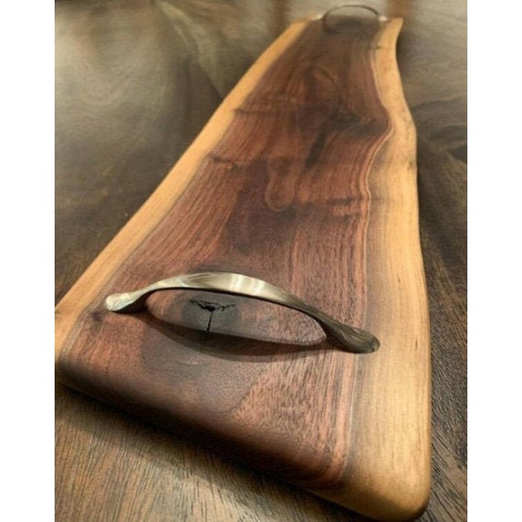 https://assets.wfcdn.com/im/30848457/resize-h755-w755%5Ecompr-r85/1888/188803956/Stumps+Custom+Wood+Walnut+Wood+Cutting+Board.jpg
