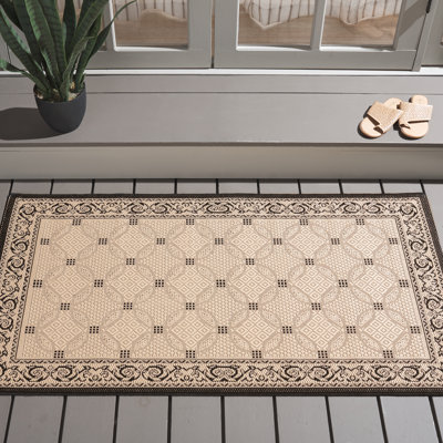 Tapis intérieur / extérieur ivoire / noir Arneshia