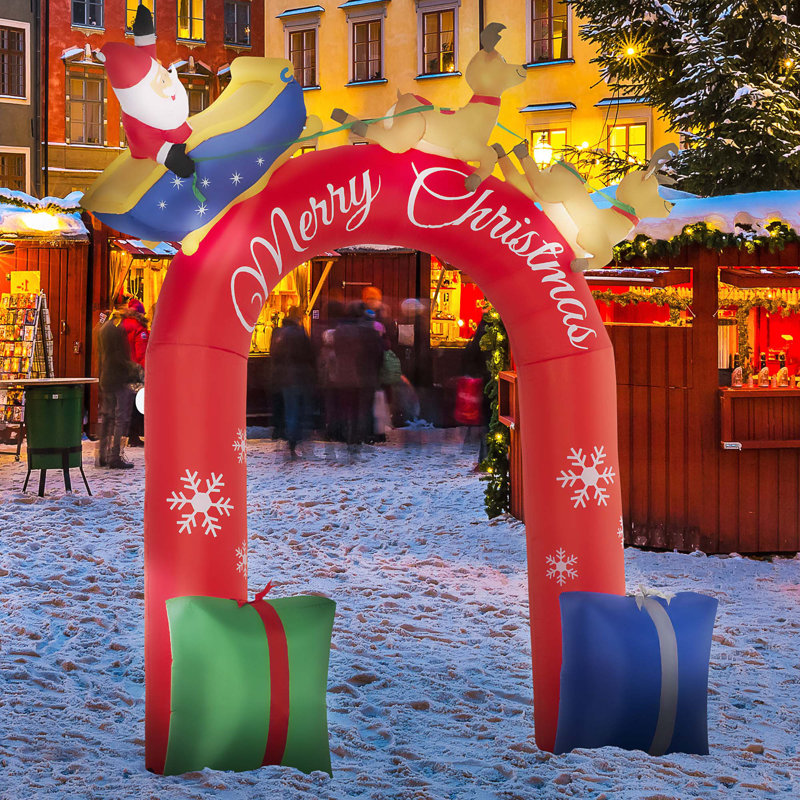 Arche de Noël avec père Noël sur un traîneau gonflable