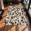 Tapis moderne en cuir de vache à motif géométrique brun clair-492633041