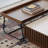 A mid-style walnut-colored coffee table set