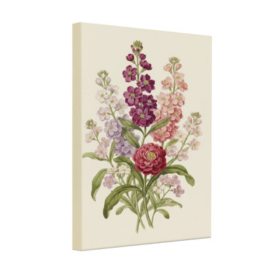 Arrangement floral de plantes et de fleurs avec des fleurs mauves roses et rouges