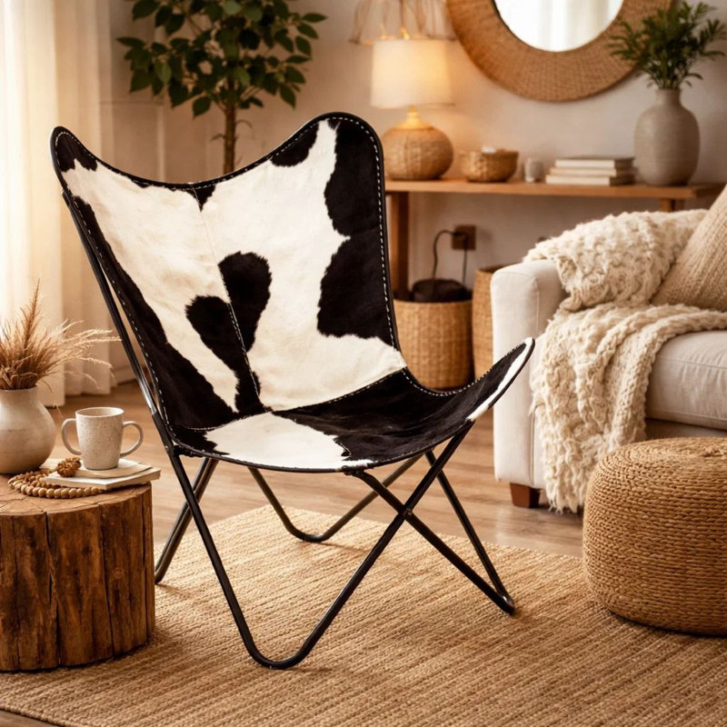 Fauteuil papillon, revêtement en cuir de vache véritable noir et blanc, métal