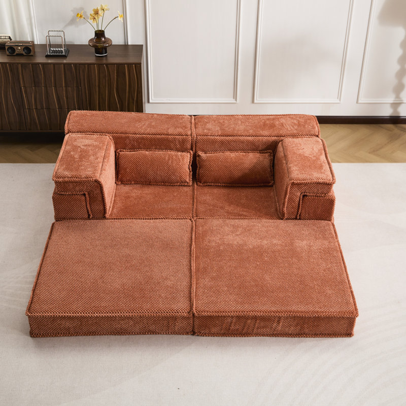 Matelas à compression orange, lit de sol convertible avec coussins ronds en polaire de haute qualité à assembler soi-même, idéal pour la décoration intérieure.