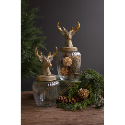 SET OF TWO GLASS CANISTERS WITH REINDEER TOPS