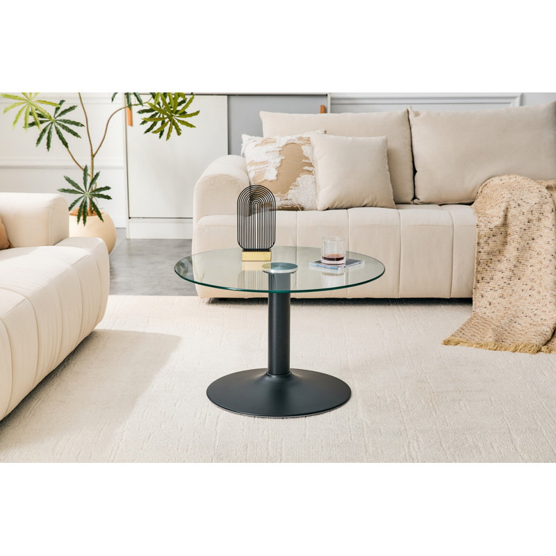 Table basse ronde en verre trempé de 27,5 pouces de diamètre. 17,7 pouces de haut, soutenu par une base en métal noir, avec un bord de luxe léger.