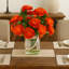 Ranunculus Fall Arrangement in a Glass Vase with Rope Accent