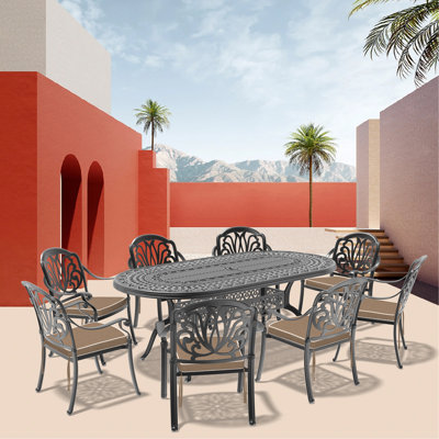 9-Piece Set Of Cast Aluminum Patio Furniture With Black Frame And Brown Seat Cushions