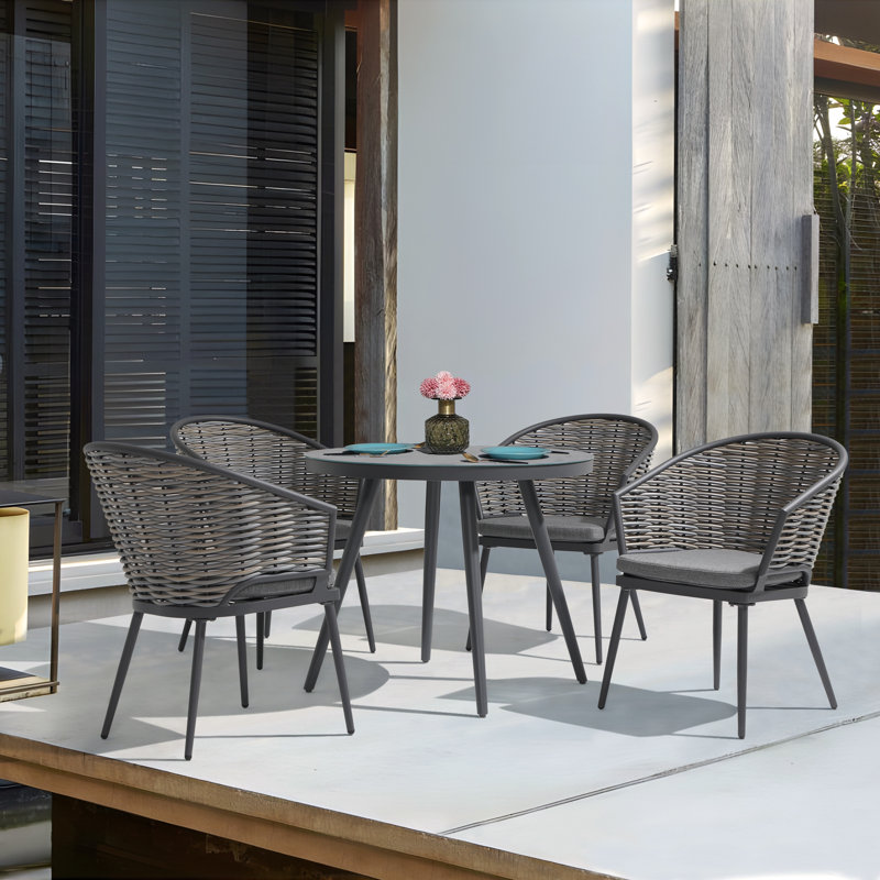 Fauteuil de salle à manger d'extérieur en osier avec coussin Mosier