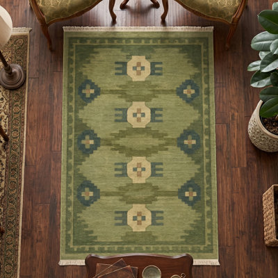 Tapis vert olive à losanges