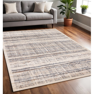 5' X 8' Beige Gray And Brown Abstract Area Rug