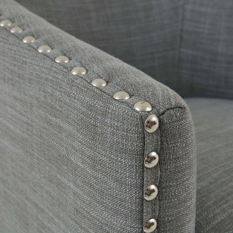 Fauteuil pivotant demi-tonneau avec garniture cloutée, Gris