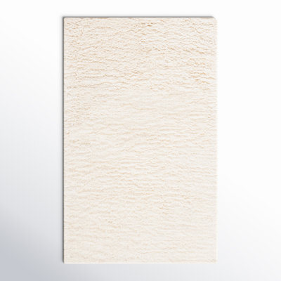 Abriel Solid Color Handmade Wool Area Rug in Ivory